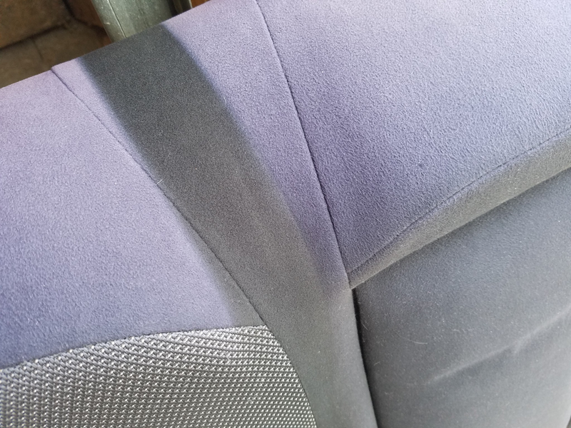 the original colour nicely preserved beneath where the middle seatbelt always lies across the seat